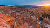 USA, Utah, Panoramic view of iconic Hoodoos at sunrise in the amphitheater of Bryce Canyon National Park.