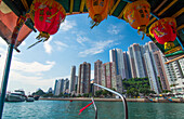 Hong Kong China Aberdeen from boat in water of reclaimed land with sktscraper condos