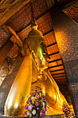 Thailand, Bangkok. Reclining Buddha inside Wat Pho.