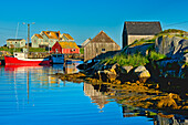 Canada, Nova Scotia, Peggy's Cove. Fishing boats in village harbor.