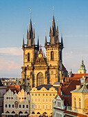 Europe, Czech Republic, Prague. Tyn Church, founded in 1385, dominates one side of the Old Town Square in Prague. The towers of this powerful looking Gothic church (with a Baroque interior) can be seen from all over Prague.