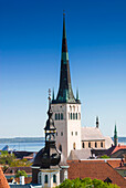 Medieval town walls and spire of St. Olav church, view of Tallinn from Toompea hill, Old Town of Tallinn, UNESCO World Heritage Site, Estonia, Baltic States, Europe