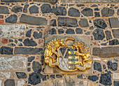 Medieval coat of arms at the entrance to Stolpen Castle, Saxony, Germany