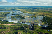 Victoria Falls or   Mosi-oa-Tunya   (The Smoke that Thunders), and Zambezi River, Zimbabwe / Zambia border, Southern Africa .
