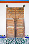 antique wooden door in Bahia Palace in Marrakesh, Morocco