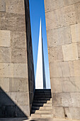 Yerevan, Yerevan Province, Armenia. The Memorial Column (The Reborn Armenia), seen from inside of the Memorial Hall at the Tsitsernakaberd Armenian Genocide Memorial Complex.