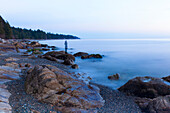 Long exposure of a transparent image of woman on the beach in Sechelt, British Columbia, Canada