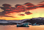Icebergs from the Jokulsarlon glacier adrift in sunset in Jokulsarlon lagoon in Iceland