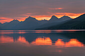 Red sky at dawn, Lake McDonald, Glacier National Park, Montana.