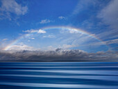 USA, Washington State, Seabeck. Composite of rainbow over Hood Canal.