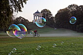 Soap bubbles at Monopteros, English Garden, Munich, Upper Bavaria, Bavaria, Germany