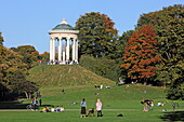People enjoy an autumn afternoon in the English Garden, with the Monopteros in the background, Munich, Upper Bavaria, Bavaria, Germany