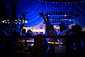 View of a beer tent with people celebrating at the Oktoberfest, Munich, Bavaria, Germany, Europe