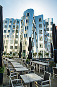 Terraces in front of the Gehry buildings by the Rhine River in Düsseldorf, Germany