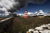 Narsholmen lighthouse. Framed by old quarry stone walls. Narsholmen, Stänga, Gotland, Sweden.