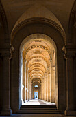 Hallway to the pyramid and courtyard at the Louvre in Paris, France.