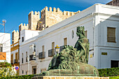 The monument to King Sancho IV El Bravo in front of Guzman Castle in Tarifa, Andalusia, Spain