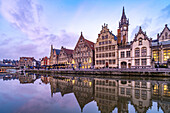 Medieval guild houses of the Graslei quay on the Leie river at dusk, Ghent, Belgium