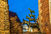 Sculpture of the Bremen Town Musicians at dusk, Free Hanseatic City of Bremen, Germany, Europe