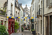 Narrow street in the old town and Tour Saint-Antoine in Loches, Loire Valley, France