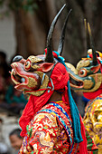Bhutan, Punakha Dzong. Punakha Drubchen Festival, masked dancers.