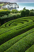 Europe, France, Etretat. Swirling design in formal garden.