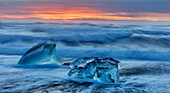 Diamond ice chards from calving icebergs on black sand beach at Jokulsarlon in south Iceland