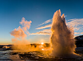The geysir Strokkur in the geothermal area Haukadalur part of the touristic route Golden Circle during winter. Iceland ()