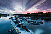 USA, Massachusetts, Lowell, Lowell National Historic Park, Pawtucket Falls and Pawtucket Dam on the Merrimac River, dusk