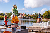 Hindu figures and temples at the Grand Bassin Temple crater lake in Mauritius, Indian Ocean