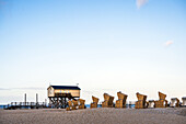 View of beach chairs and a house on stilts on the North Sea, Sankt-Peter-Ording, North Friesland, Schleswig-Holstein, Germany