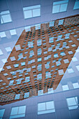 Double exposure of facade of a residential building in Milan, Italy.