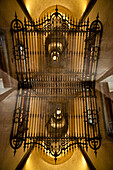 Gate and passageway at night, Milan, Lombardy, Italy