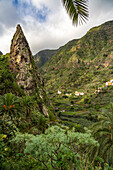 One of the twin rocks Roques de San Pedro, landmark of Hermigua, La Gomera, Canary Islands, Spain