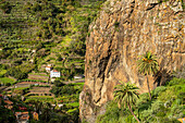One of the twin rocks Roques de San Pedro, landmark of Hermigua, La Gomera, Canary Islands, Spain