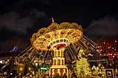 Swing carousel at Christmas time in Tivoli Gardens in Copenhagen, Denmark