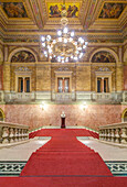 The Hungarian State Opera House, built in the 1880s, interior double staircase with a red carpet.