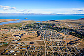 Aerial view of El Calafate, a sprawing town on the coast, a sea channel, on the edge of the Southern Patagonian Ice Field.