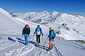 Three people on a ski tour ascending to the Rosskopf, Rosskopf, Hochfügen, Zillertal, Tux Alps, Tyrol, Austria