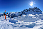Woman on ski tour ascending to Torhelm, Brandberger Kolm in background, Torhelm, Gerlospass, Zillertal Alps, Tyrol, Austria
