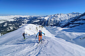 Two people on a ski tour ascending to the Torhelm, Torhelm, Gerlos Pass, Zillertal Alps, Tyrol, Austria