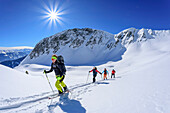 Four people on a ski tour ascending to the Kellerjoch, Kellerjoch, Zillertal, Hochfügen, Tux Alps, Tyrol, Austria
