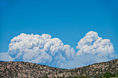 Usa, New Mexico, Santa Fe, Smoke over hills during Calf Canyon/ Hermits Peak Fire