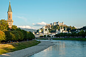 Austria, Salzburg, View of fortress along river
