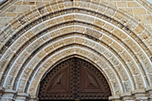 Portugal, Evora, Stone archway above church door
