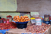 Selling chili at the weekly market in Techiman in the Bono East region of central Ghana in West Africa