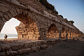 Aqueduct on the beach of the ancient city of Caesarea Maritima, Israel, Middle East, Asia