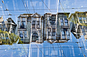 Double exposure of a Victorian style wooden residential building on Hayden street in San Francisco, California.