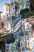 Doppelbelichtung eines farbenfrohen Wohngebäudes aus Holz im viktorianischen Stil in der Steiner Street in San Francisco, Kalifornien