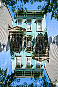 Double exposure of a Victorian style colorful wooden residential building in the famous mission district in San Francisco, California.